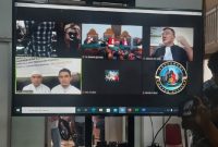 Putra Siregar dan Rico Valentino menjalani sidang perdana kasus pengeroyokan di Pengadilan Negeri Jakarta Selatan, Kamis (23/6/2022), dengan dihadirkan secara virtual. Foto: KOMPAS