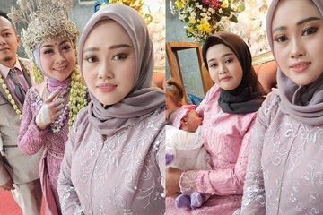 Sabarnya istri pertama, dampingi sang suami nikah lagi pinang istri kedua, sempat foto di pelaminan sambil gendong anaknya. Foto: TikTok @lia.sugiandie