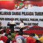 Pasangan Calon Wali Kota dan Wakil Wali Kota Batam nomor urut 2, Amsakar Achmad dan Li Claudia, hadir di Deklarasi Pilkada Damai Tahun 2024, yang diselenggarakan oleh Polresta Barelang, bertempat di Beverly Hotel, Lubuk Baja, Kota Batam, Selasa (24/9/2024) pagi. Foto: INIKEPRI.COM
