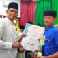 Siswa MTsN Tanjungpinang Zaidan berhasil meraih Juara 1 cabang Tilawah Remaja pada ajang Musabaqah Tilawatil Qur’an dan Hadist (MTQH) Kelurahan Pinang Kencana. Foto: INIKEPRI.COM