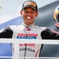 Pembalap asal Indonesia, Veda Ega Pratama memegang trofi dan helmya di podium Moto3 Brasil, Minggu, 22 Maret 2026. Foto: Instagram/veda_54