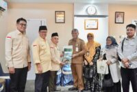 Sekda Kota Batam, Firmansyah, menerima Laporan Tahunan 2025 BAZNAS Batam di Kantor Wali Kota Batam. Foto: INIKEPRI.COM/Media Center Batam